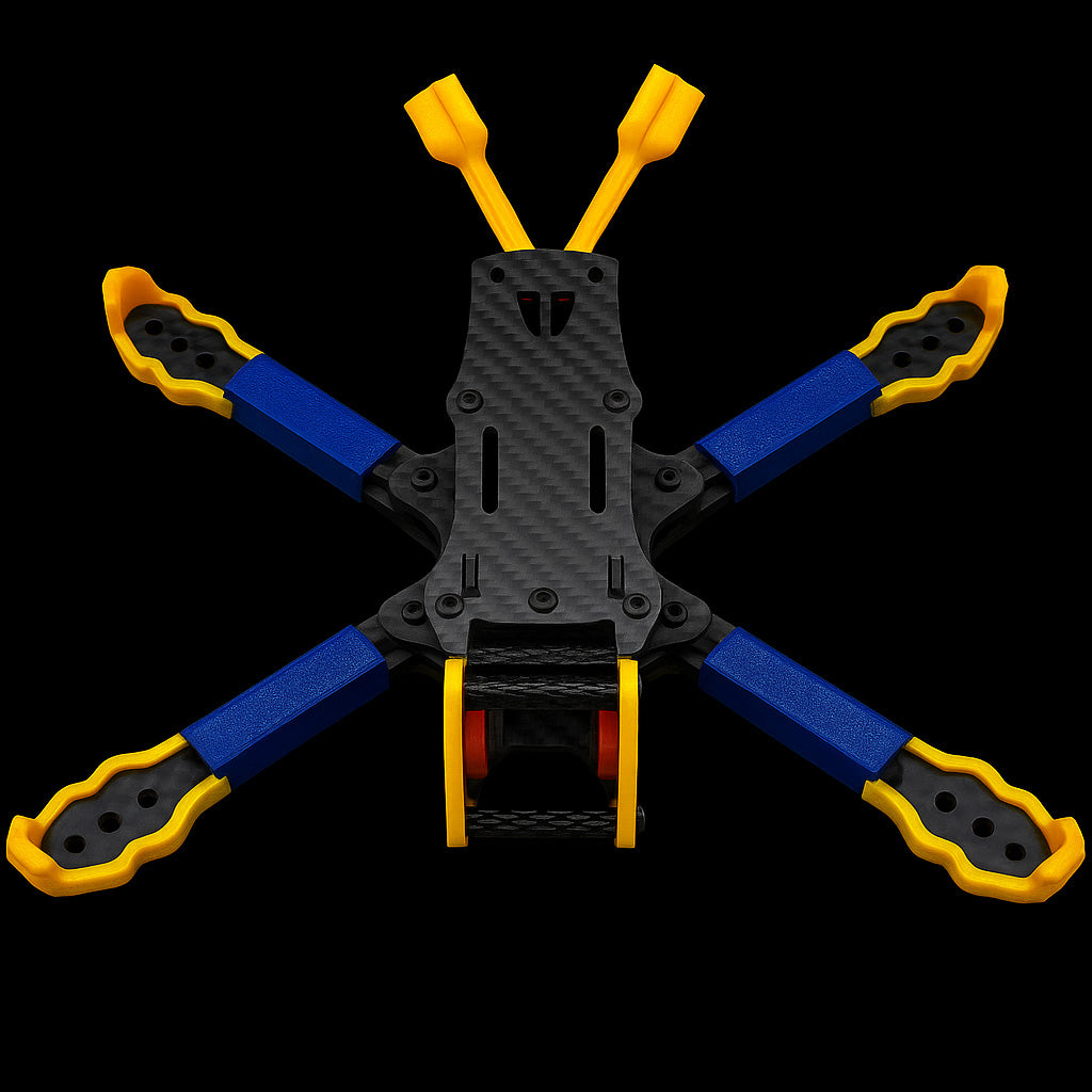 Top-down shot of the ILLmatic frame outfitted with Flyclops 3D printed parts  including yellow bumpers, blue arm protectors, and dual antenna tubes for optimal freestyle performance.