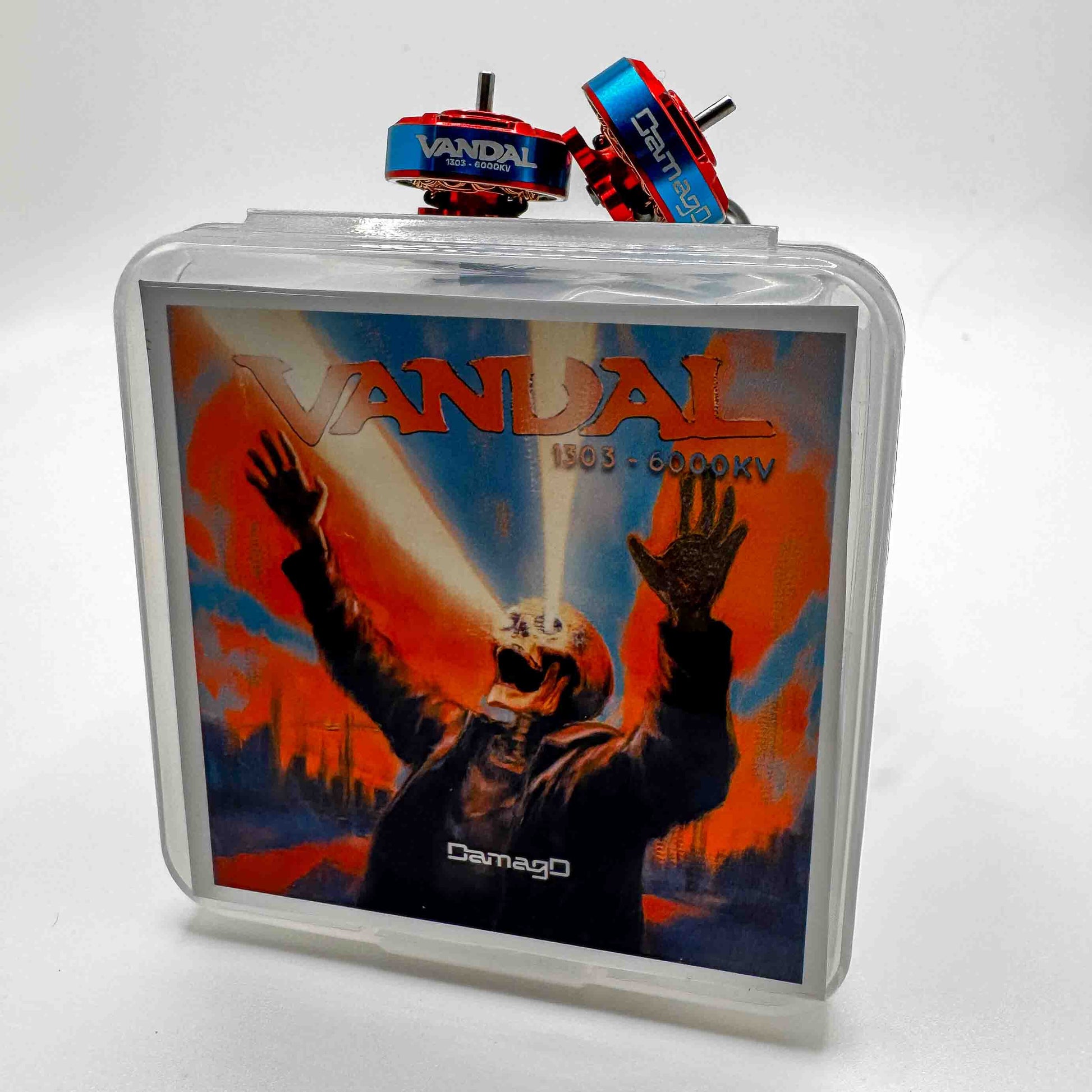 Vandal 1303 6000KV FPV motors by DamagD shown with street-style packaging and desk setup; rivals RCINPOWER 1303 and Caddx 1303 motors for micro cinematic and freestyle builds.