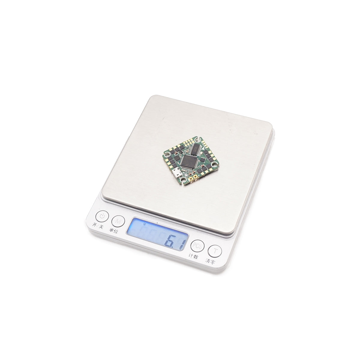 TuneRC Poly F405 AIO flight controller on digital scale, weighing 6.1 grams — ultra-lightweight 20x20mm FPV drone board.